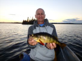 guy holding fish